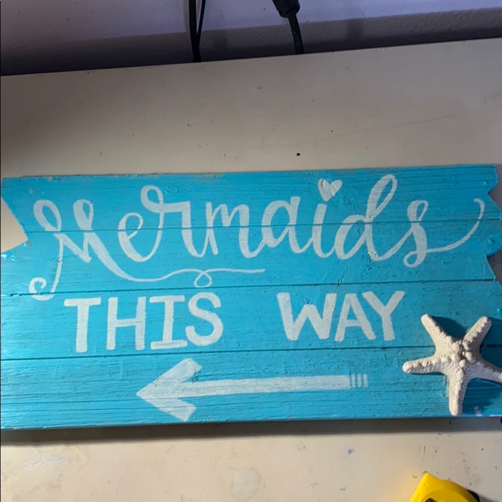 Blue mermaid sign